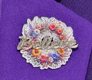 MWGM Billie's watchword, "Believe" over a background of wildflowers